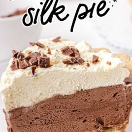 close up shot of a slice of french silk pie garnished with chopped chocolate on a white plate