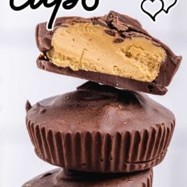 homemade peanut butter cups stacked on a wooden board