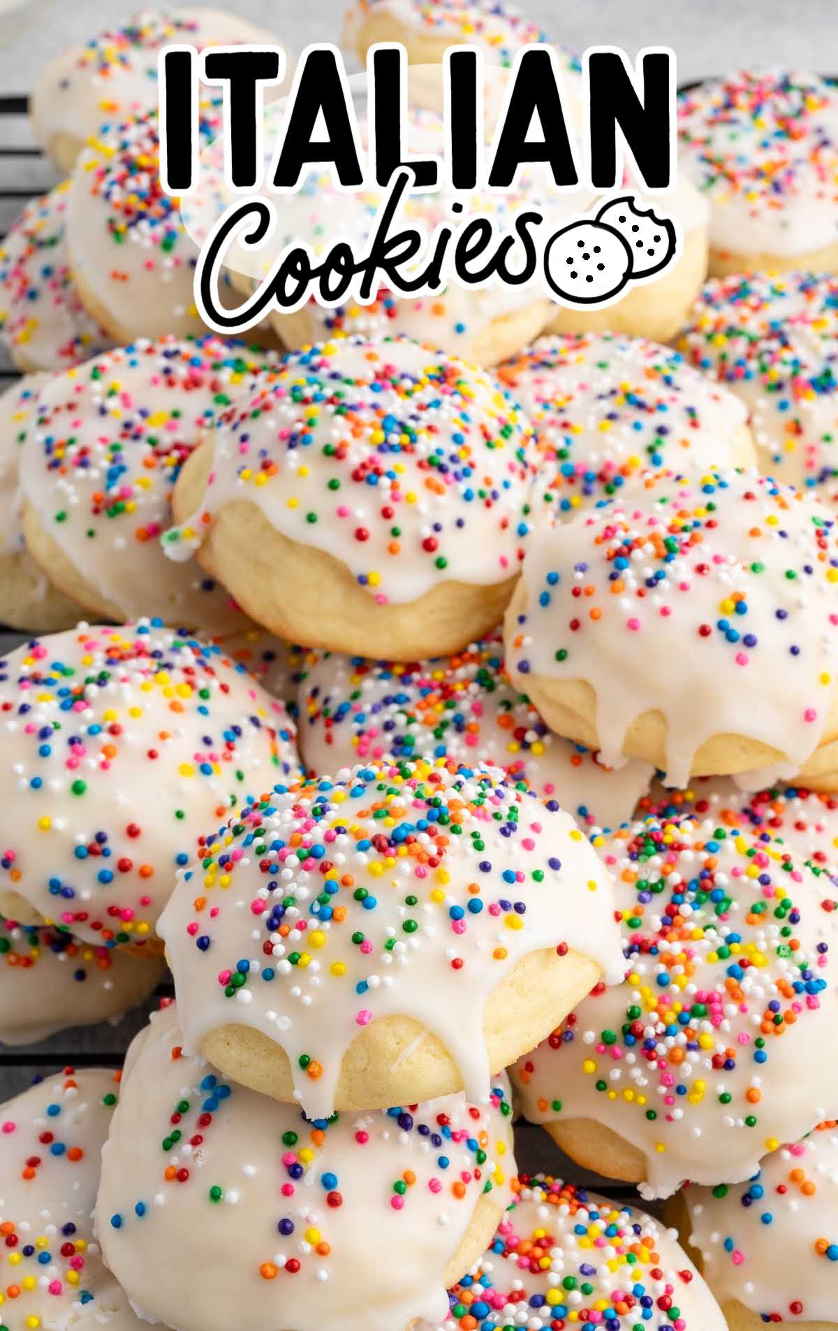 Overhead shot of a big platter of iced Italian cookies with rainbow sprinkles