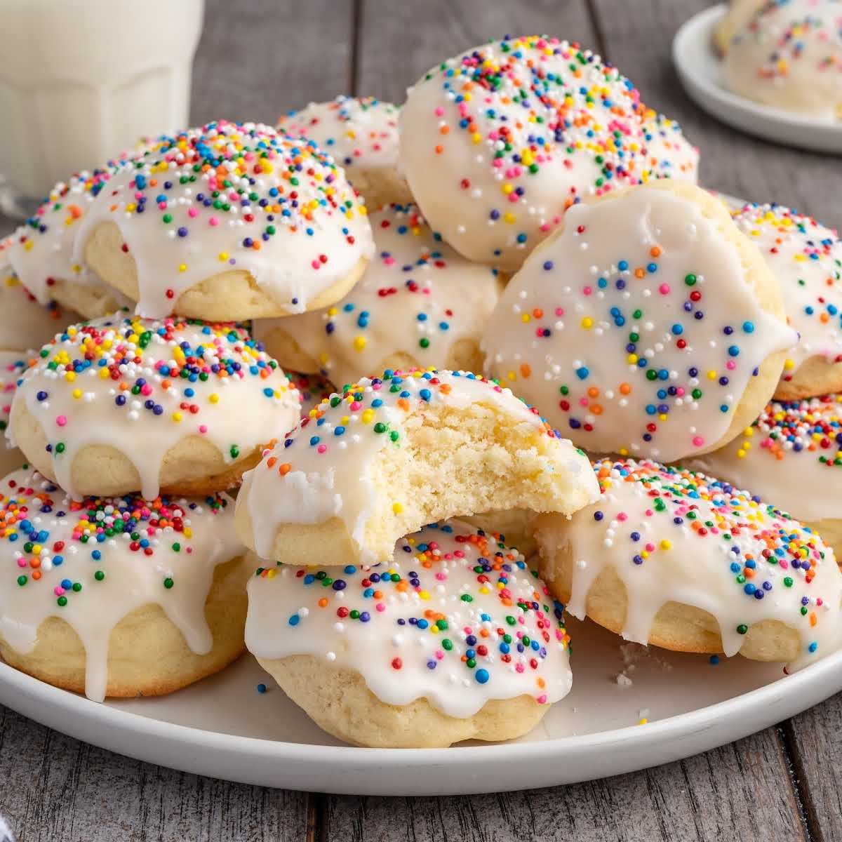Italian cookies recipe card showing finished iced cookies with rainbow sprinkles