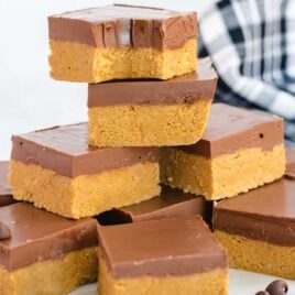 close up shot of No-Bake Peanut Butter Bars stacked on top of each other