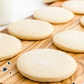 close up shot of sugar cookies on a wooden board