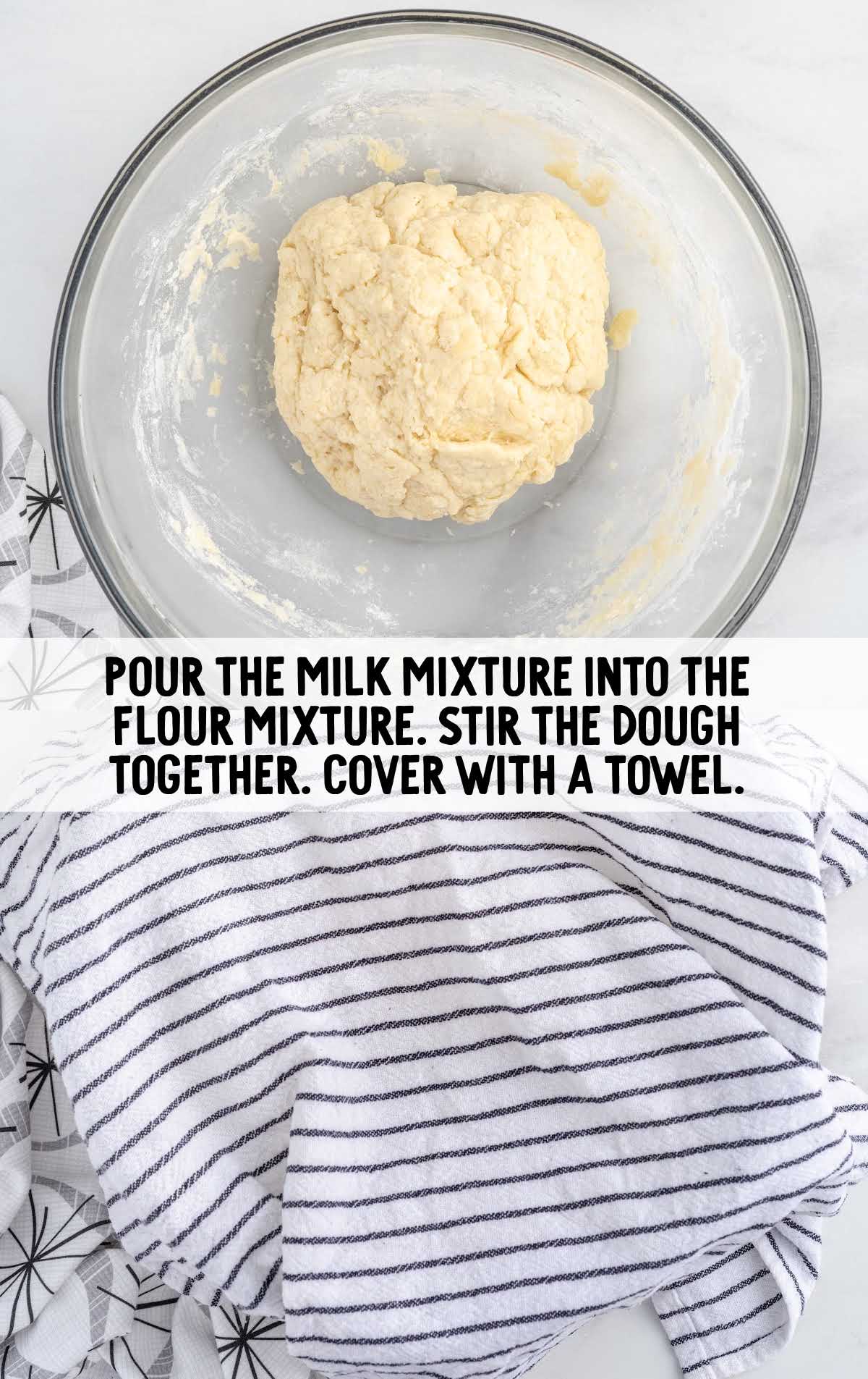 dough in a bowl covered with a towel