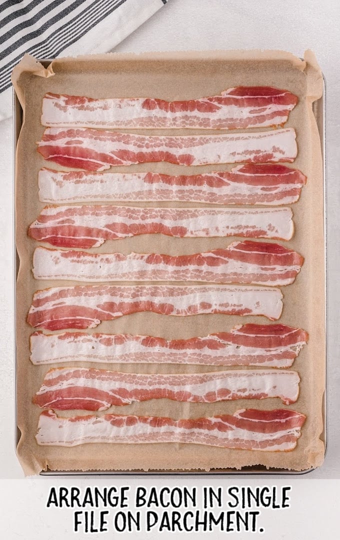bacon being placed on parchment