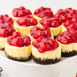 close up shot of mini cherry cheesecake on a dish