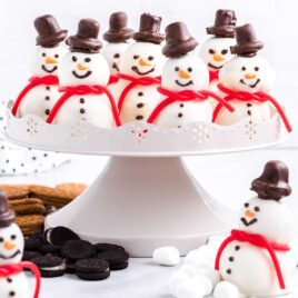 close up shot of snowmen truffles on a serving tray with mini marshmallows and mini Oreos
