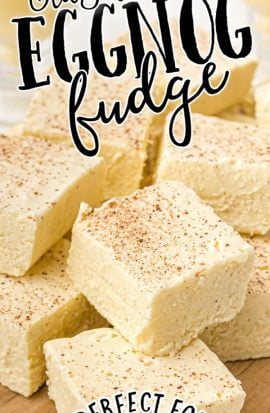 close up shot of eggnog fudge piled on top of each other on a wooden board