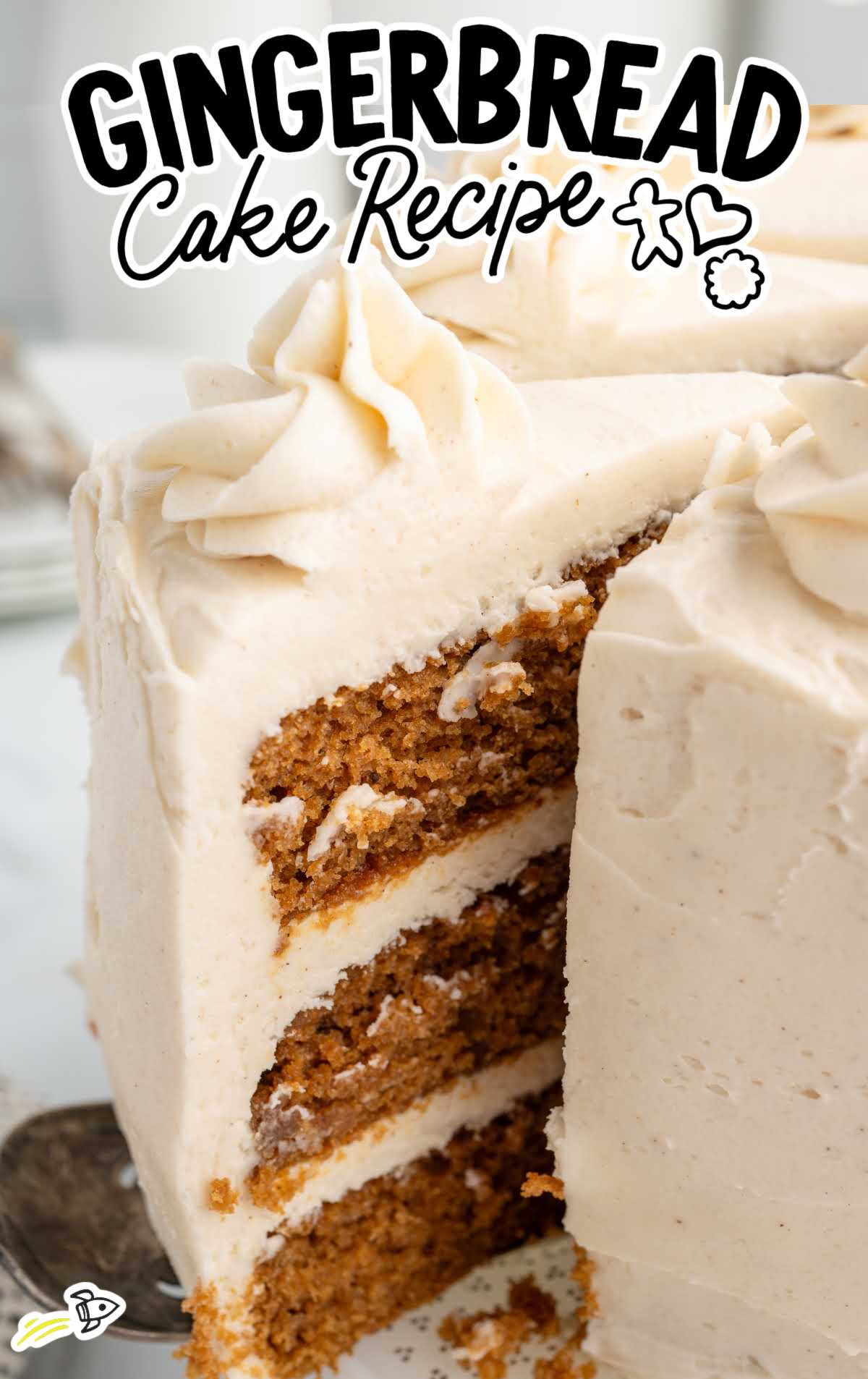 Close-up of gingerbread cake with layers of spiced cake and frosting.