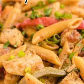 close up shot of a bowl of Chicken Fajita Pasta garnished with green onions