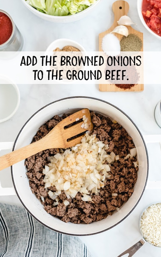 chopped onions added to the ground beef in a pan