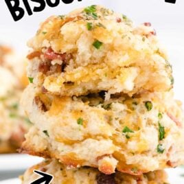 close up shot of a stack of Bacon Cheddar Biscuits garnished with chives