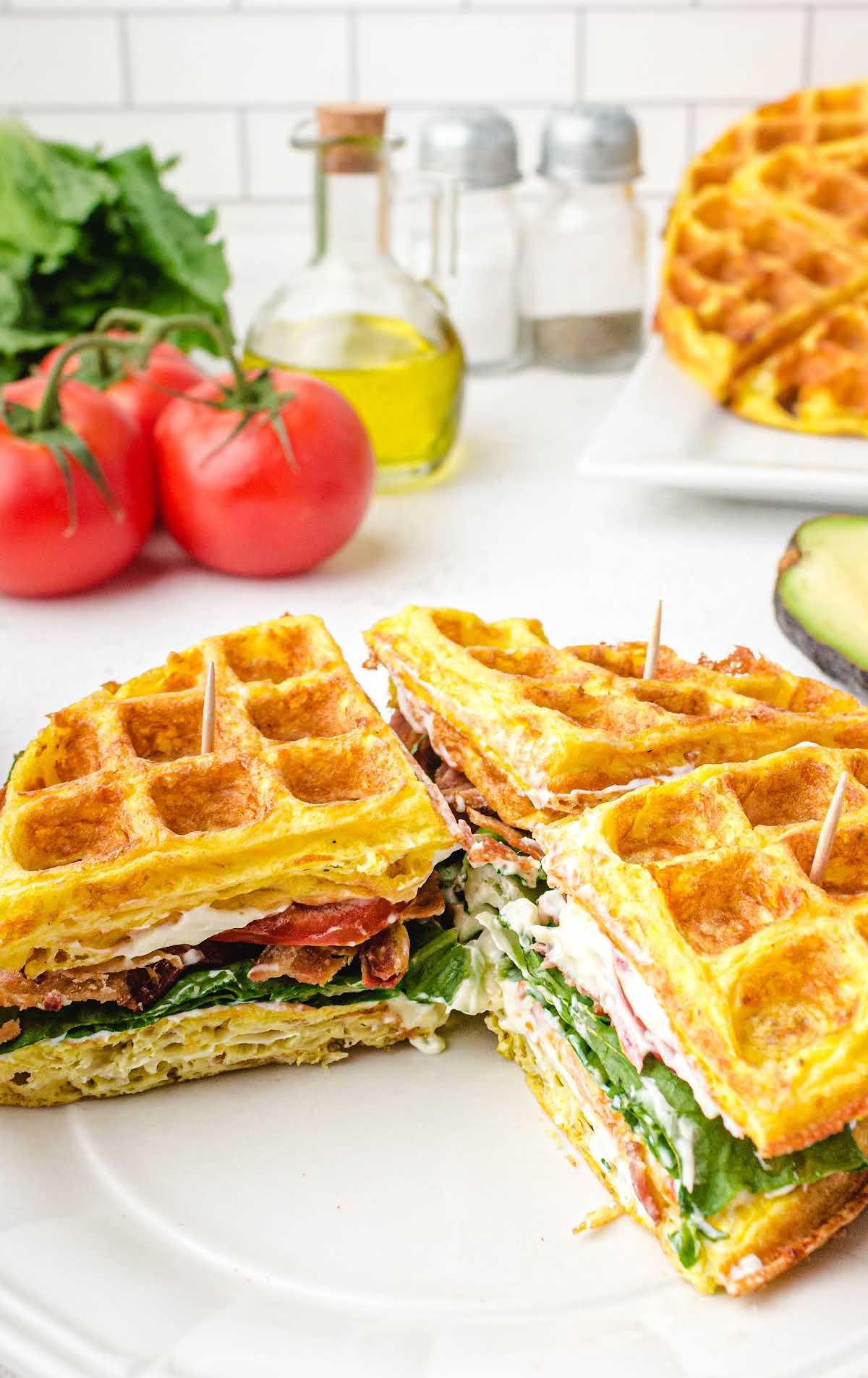 close up shot of chaffle sandwich on a white plate