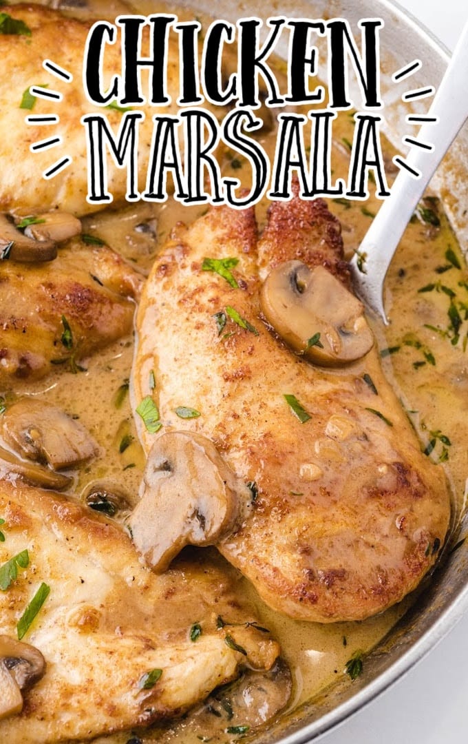 close up shot of chicken marsala with sauce and mushrooms on top in a dish