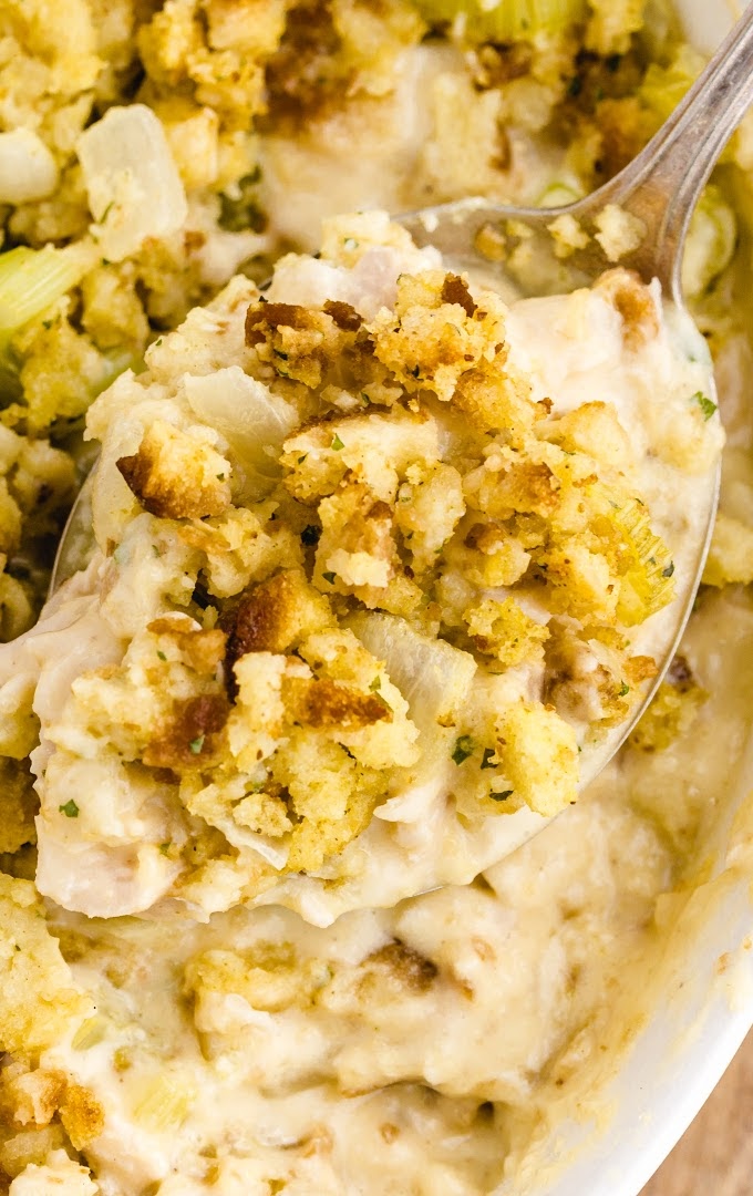close up over head shot of chicken and stuffing casserole in a white dish