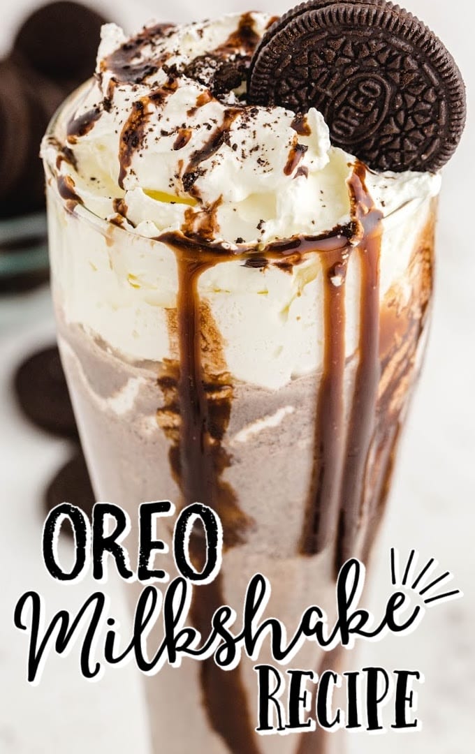 close up shot of Oreo milkshake topped with a Oreo and chocolate glaze falling down the cup