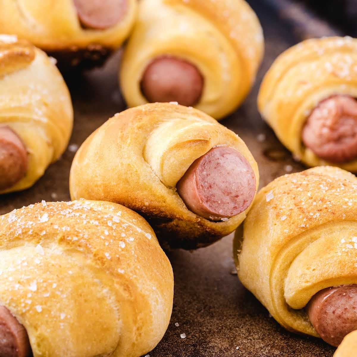 close up shot of multiple Pigs in a Blanket