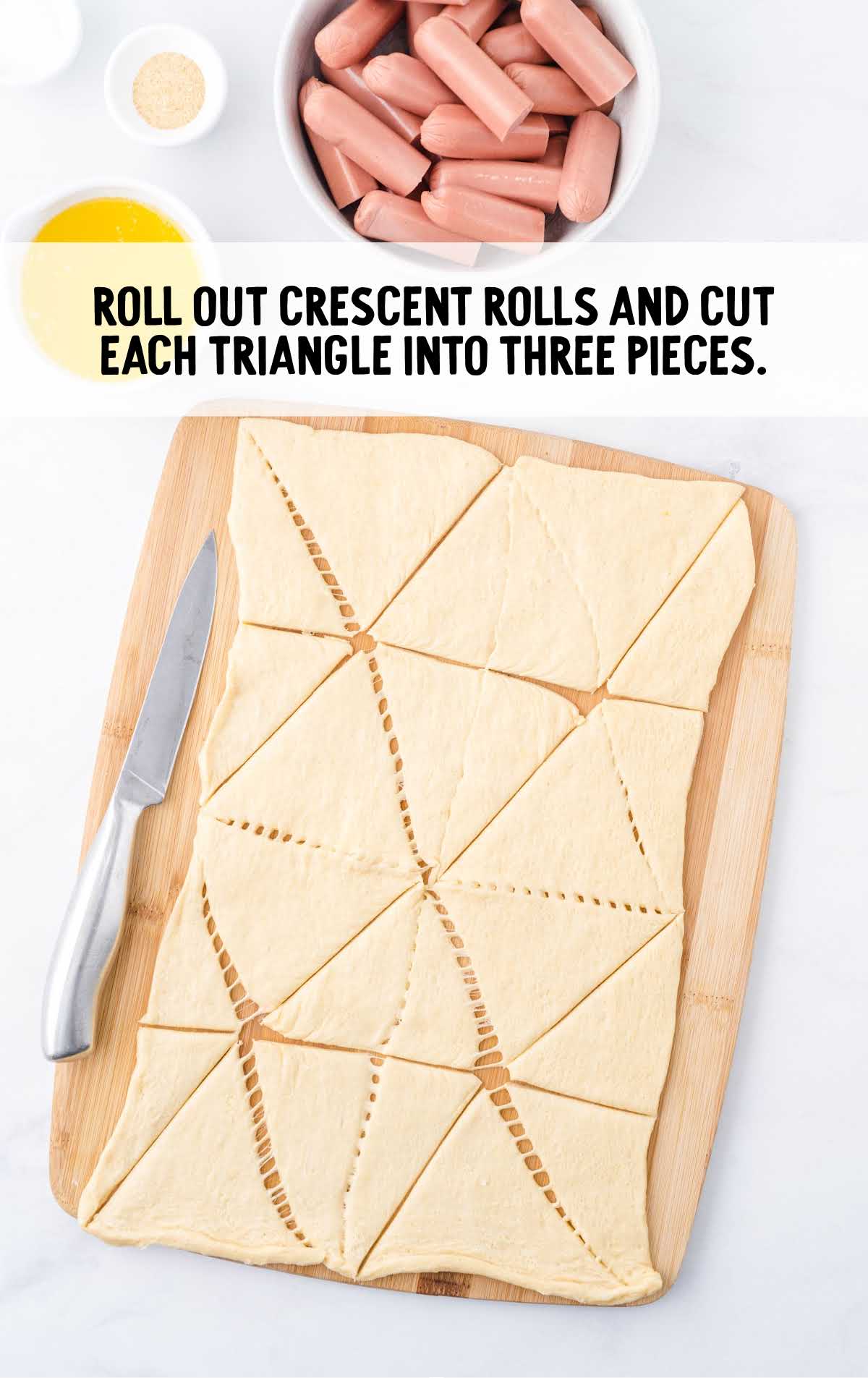 crescent roll dough rolled out and then cut each triangle into 3 pieces