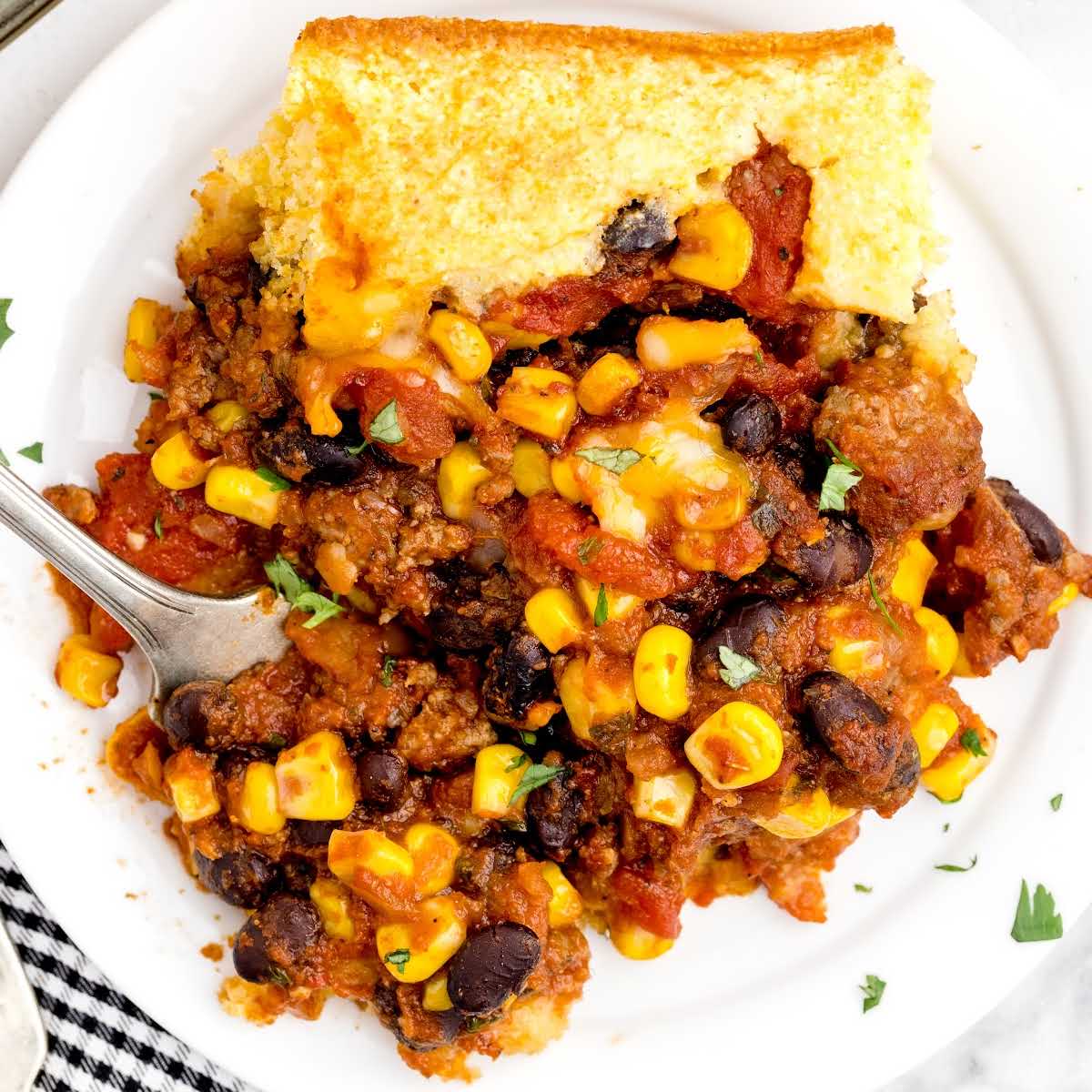 close up overhead shot of a plate of Cornbread Chili Casserole