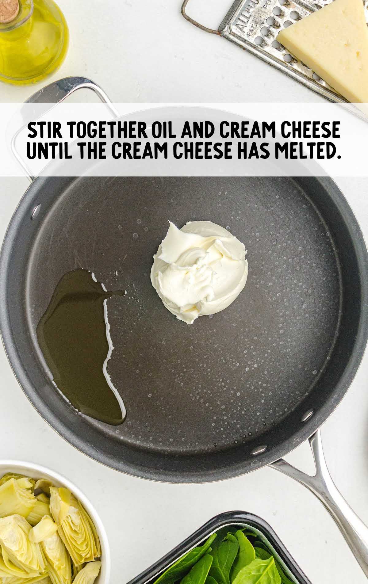 oil and cream cheese added to a pot