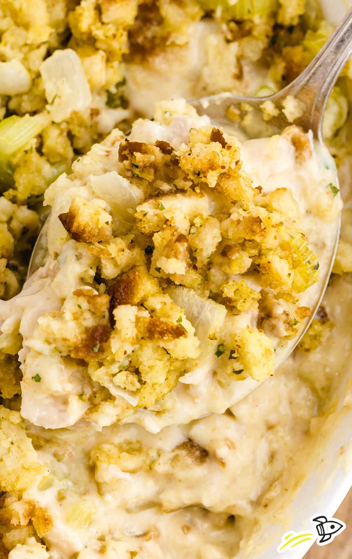 close up over head shot of chicken and stuffing casserole in a white dish