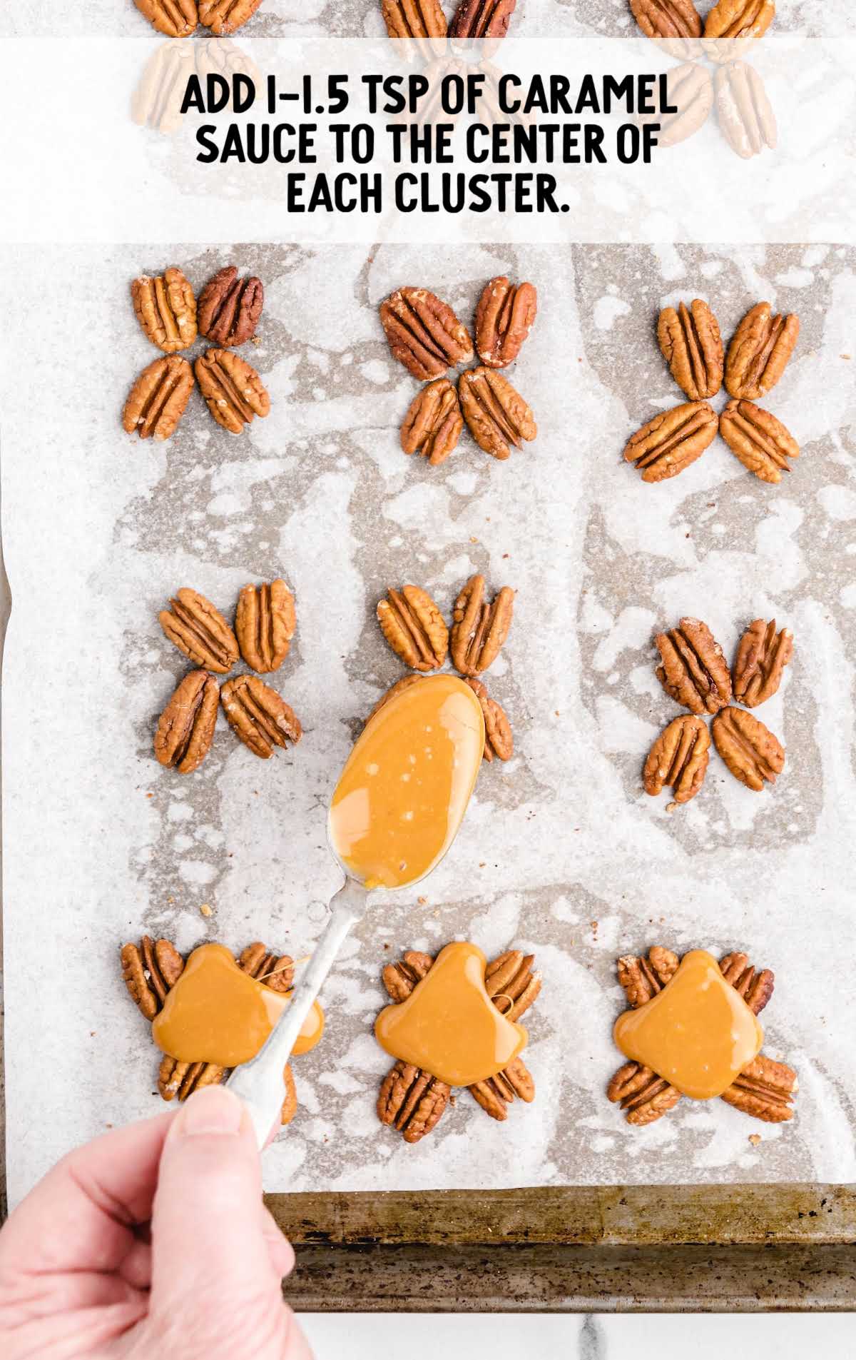 caramel spooned onto the cluster of pecans