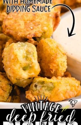 close up shot of fried pickles stacked on a plate with dipping sauce