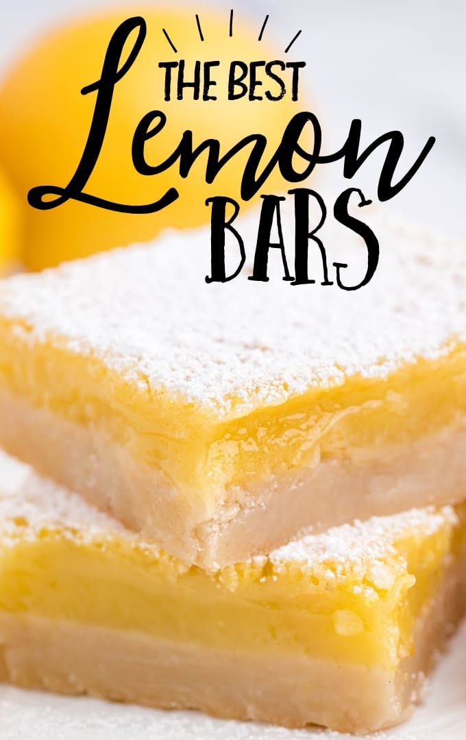 close up side shot of lemon cheesecake bars stacked on top of each other