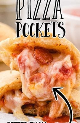 close up shot of pizza pockets pulled apart showing its gooey insides on a board