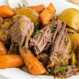close up shot of a plate of Pot Roast garnished with parsley