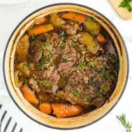 close up overhead shot of a pot of Pot Roast garnished with parsley