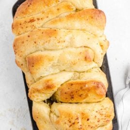 overhead shot of pull-apart garlic bread on a pan
