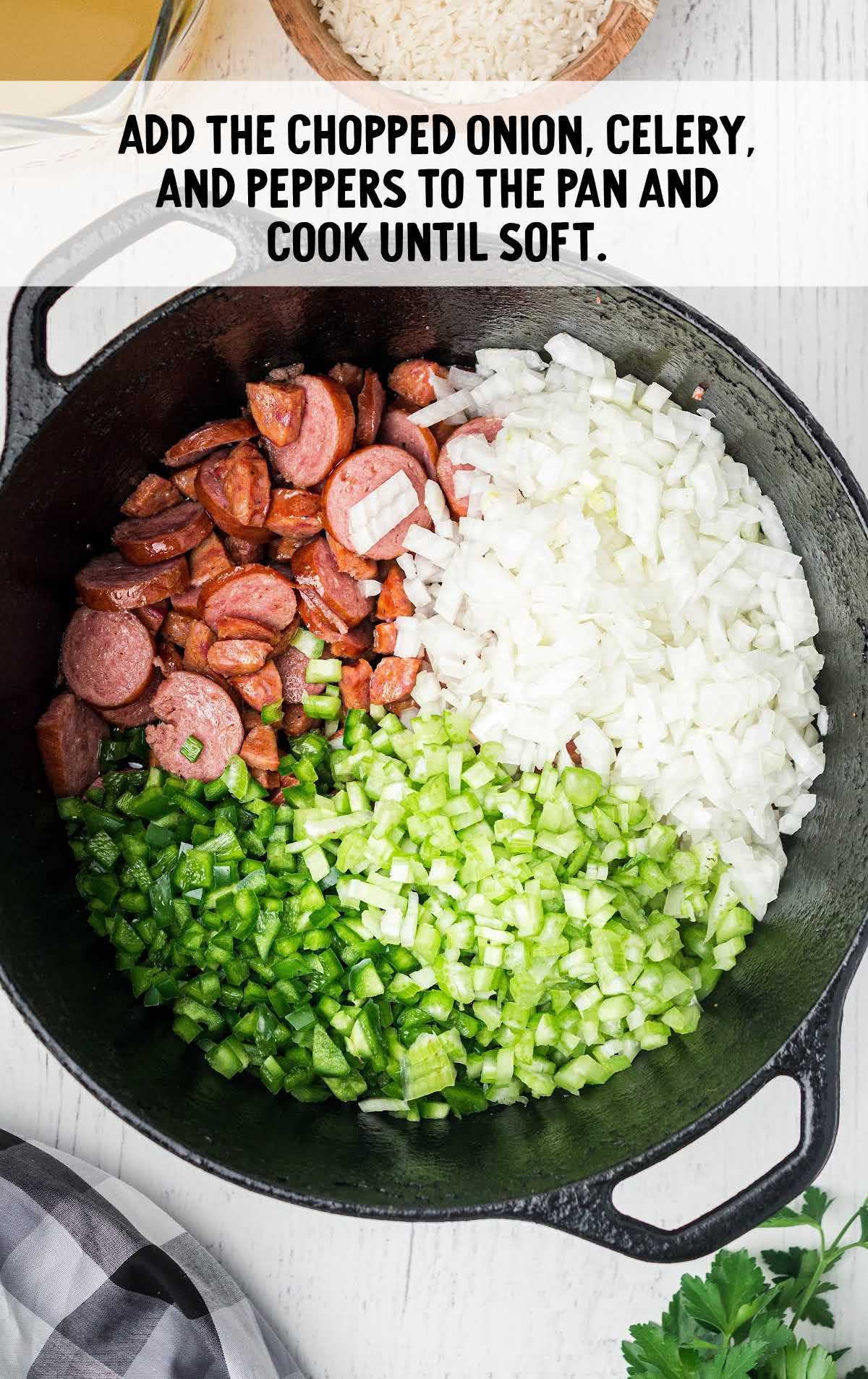 chopped onion, celery, and pepper added to the sausage in a pot
