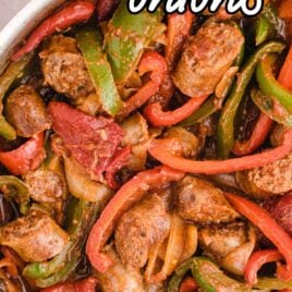 close up overhead shot of sausage and peppers in a dish