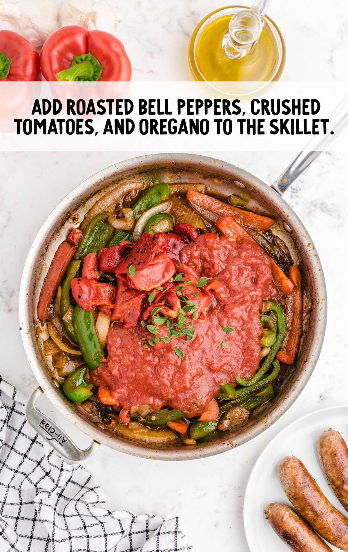 bell peppers, crushed tomatoes, and oregano added to the skillet
