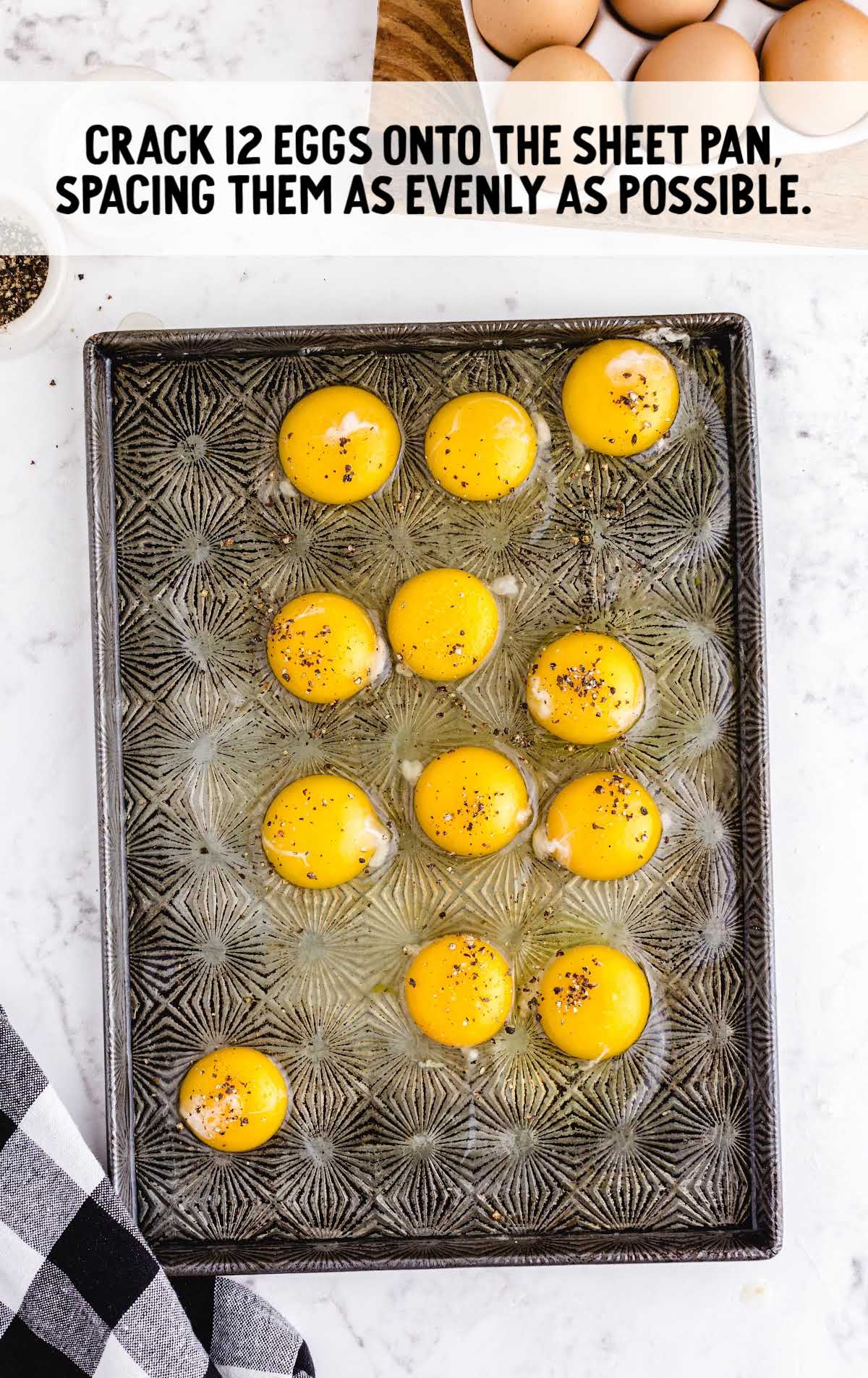 eggs cracked onto a sheet pan
