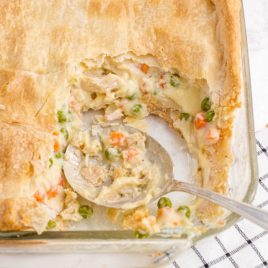 close up overhead shot of chicken pot pie bake in a clear dish
