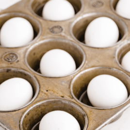 close up shot of Perfect Hard-Boiled Eggs in a muffin pan