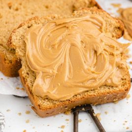 close up of peanut butter bread with peanut butter spread on