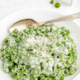 creamed peas on a bowl with a spoon