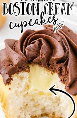 close up shot of boston cream cupcakes with chocolate frosting with a bite taken out of it showing its cream cheese filling inside