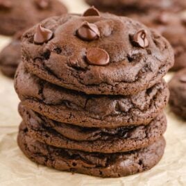 close up shot of double chocolate chip cookies stacked on top of each other