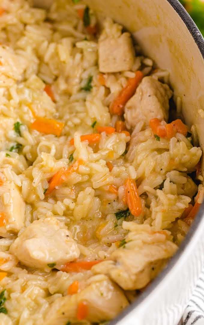 close up shot of one pot chicken and rice in a pan