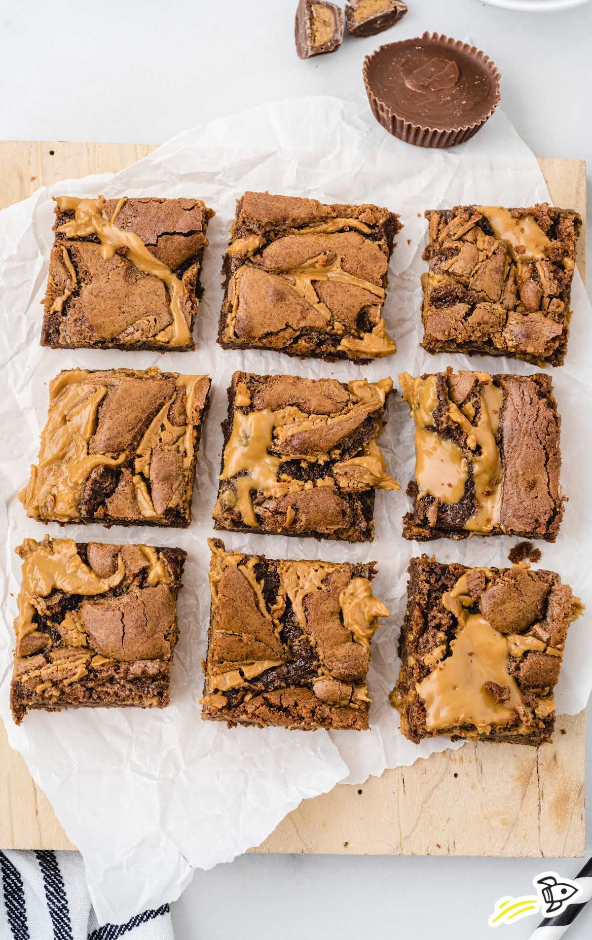 close up shot of peanut butter brownies on a wooden board