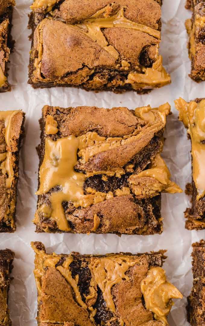 overhead shot of peanut butter brownies lined on a parchment paper
