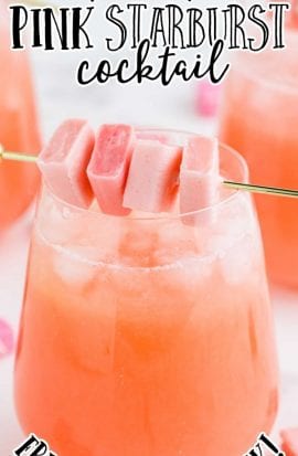 pink starburst cocktail with starburst candy in a glass