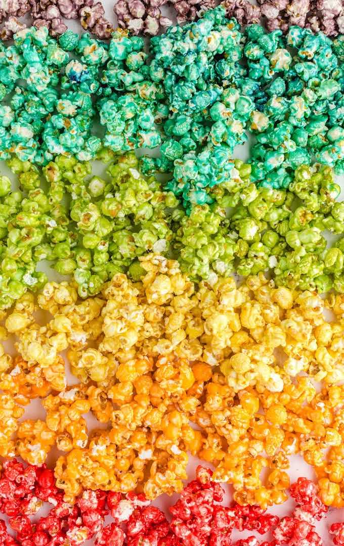 close up overhead shot of rainbow popcorn categorized by color