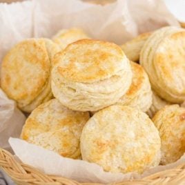 buttermilk biscuits piled in a bread basket