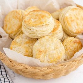 close up shot of buttermilk biscuits in a bread basket