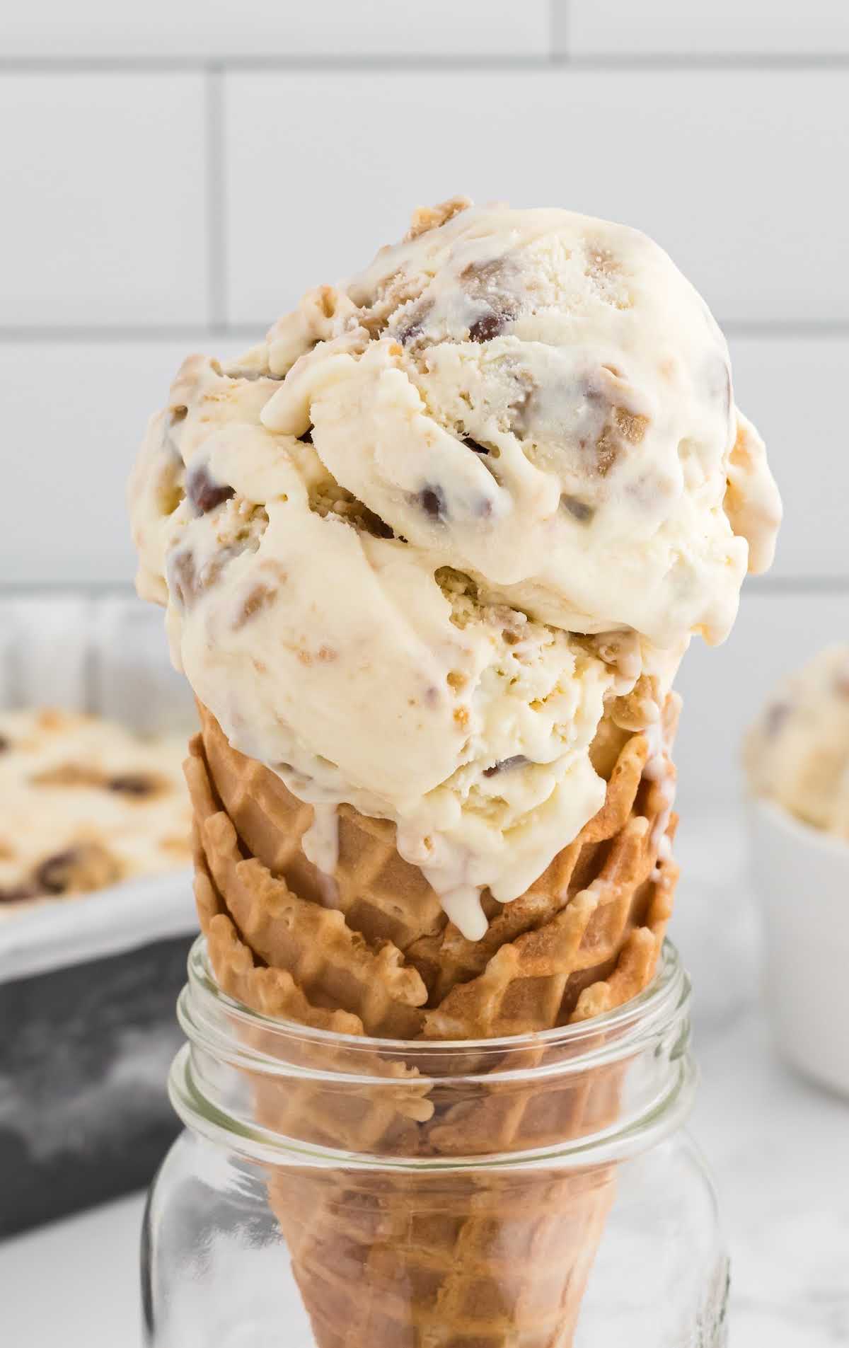 a close up shot of Cookie Dough Ice Cream in a cone
