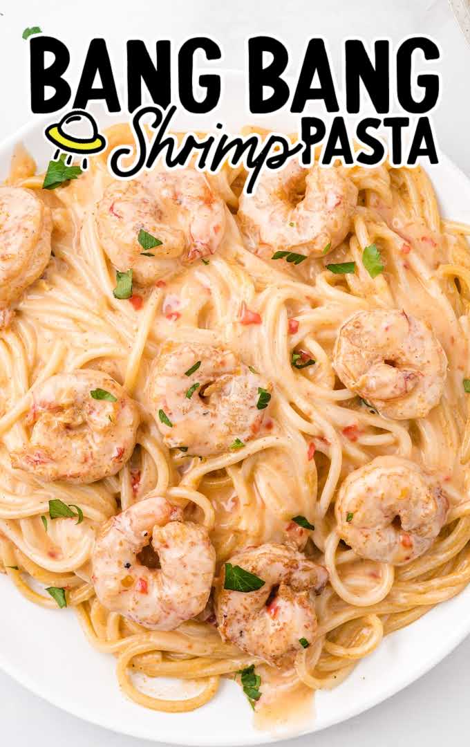close up overhead shot of bang bang shrimp pasta on a white plate